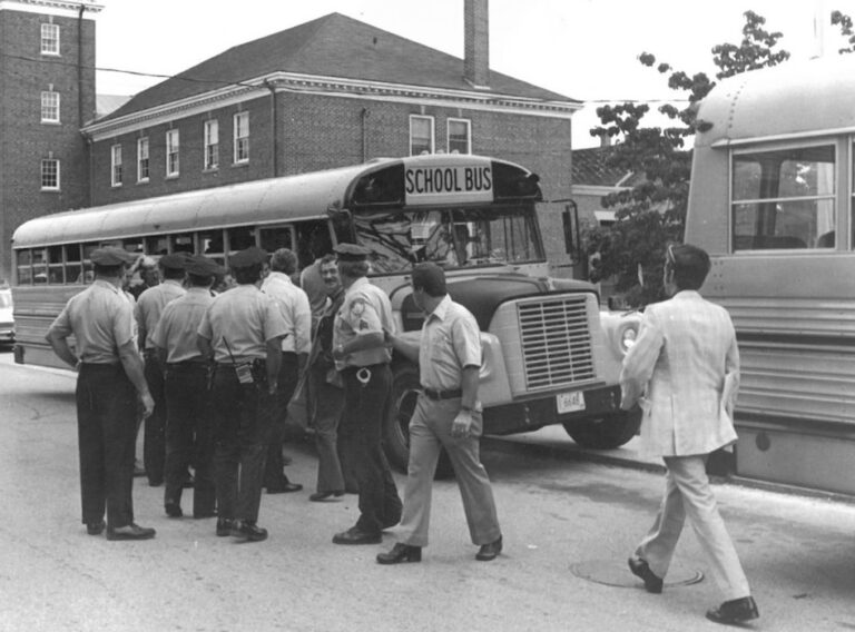 Franklin police gather in front of school bus.