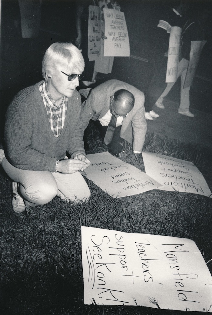 People on the ground making signs supporting the Seekonk strike.