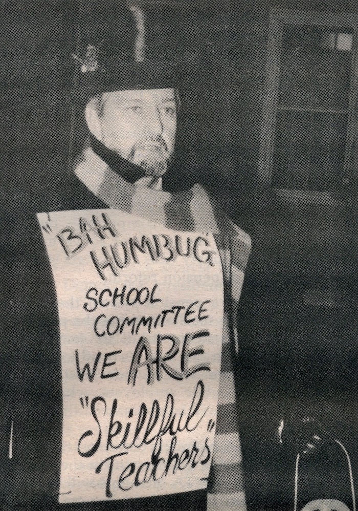 Paul Donnelly dressed as Scrooge with a sign supporting the Sharon strike.