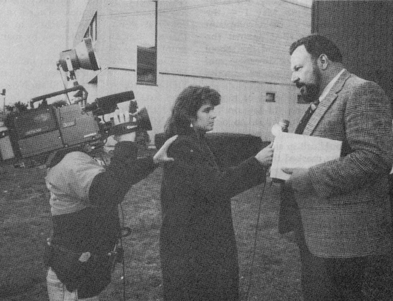 Reporter and camera man interviewing William Flecca.