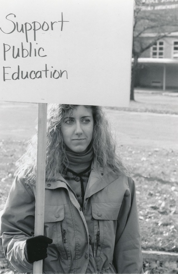 Picketer with sign supporting the Beverly strike.