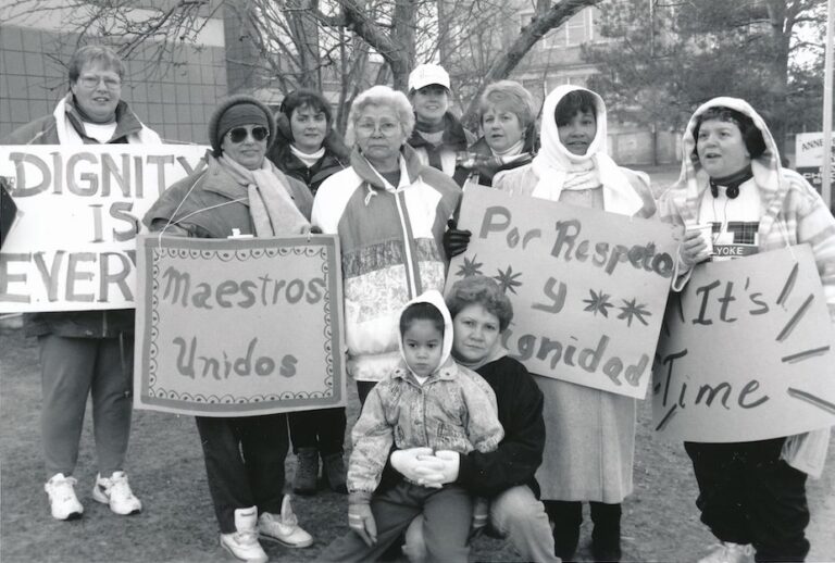 Group of people holding signs supporting the Holyoke strike.