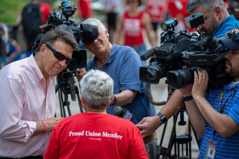 Camera men and reporter interviewing Jessica Wender-Shubow.