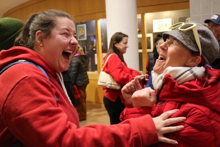 Two union members celebrating.