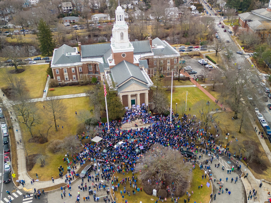 Aerial shot of a crowd gathered in front of City Hall.