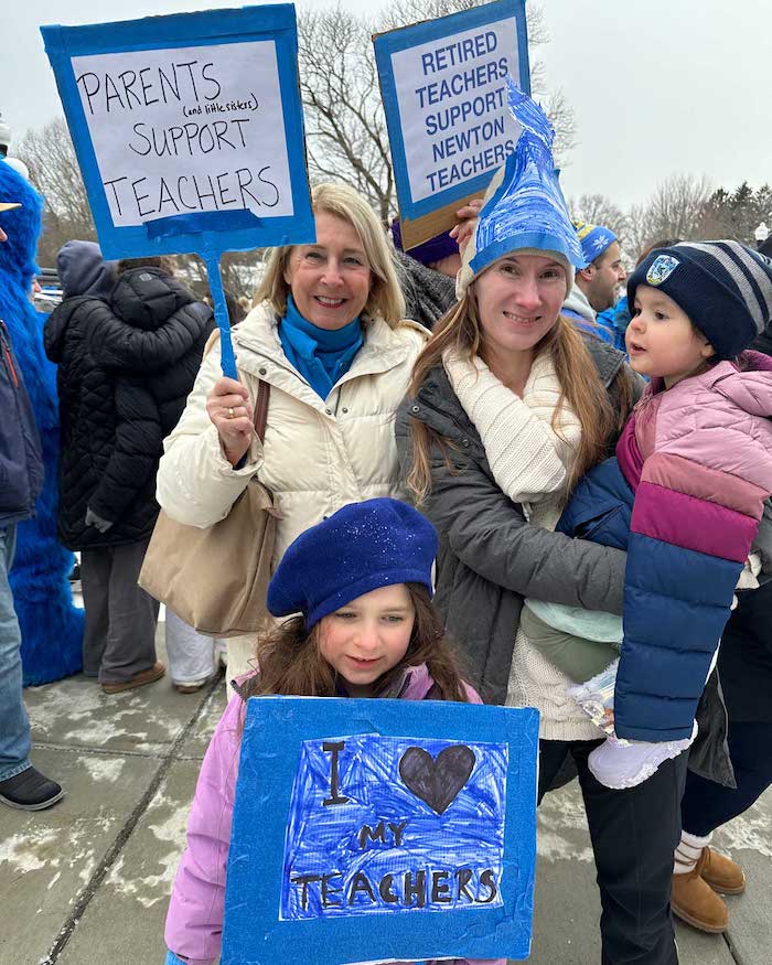Family with signs supporting the Newton strike.