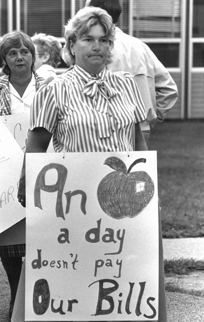Tammy Blackwell holding a sign supporting Attleboro strike.