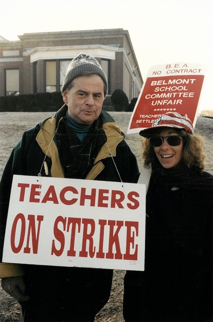 Two people with signs supporting the Belmont strike.