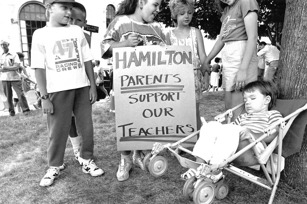 Children with sign supporting strike.