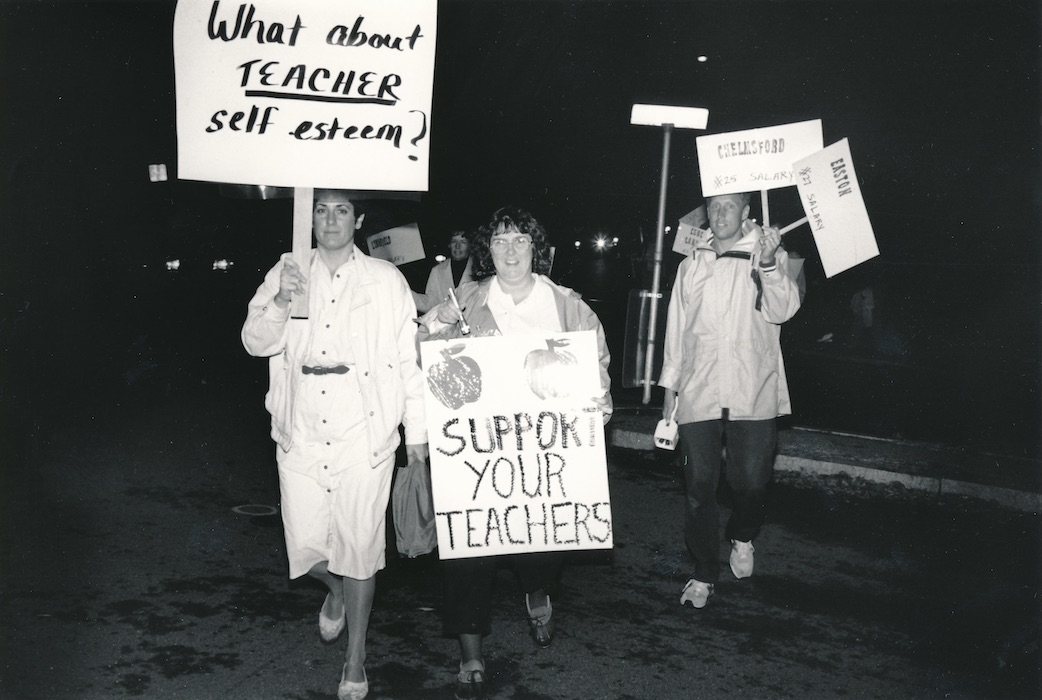 Picketers with signs supporting the Lexington strike.