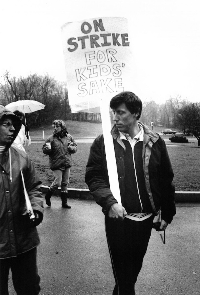 Person in picket line holding a sign supporting the Lexington strike.