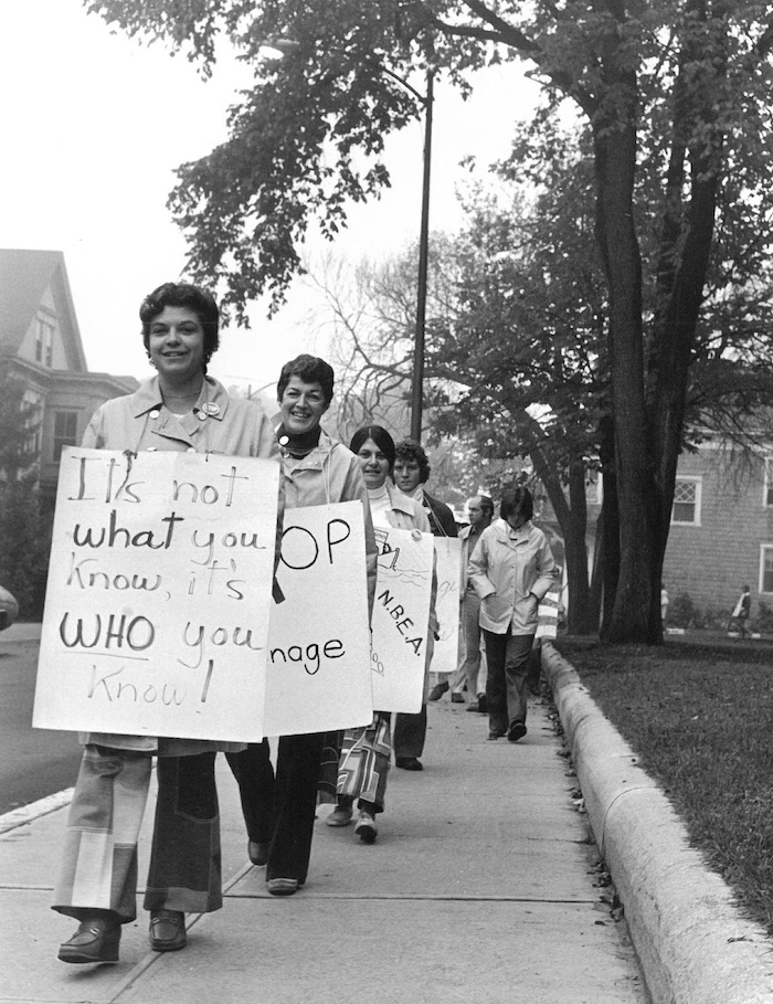 Picket line with picketers wearing signs supporting the New Bedford strike.