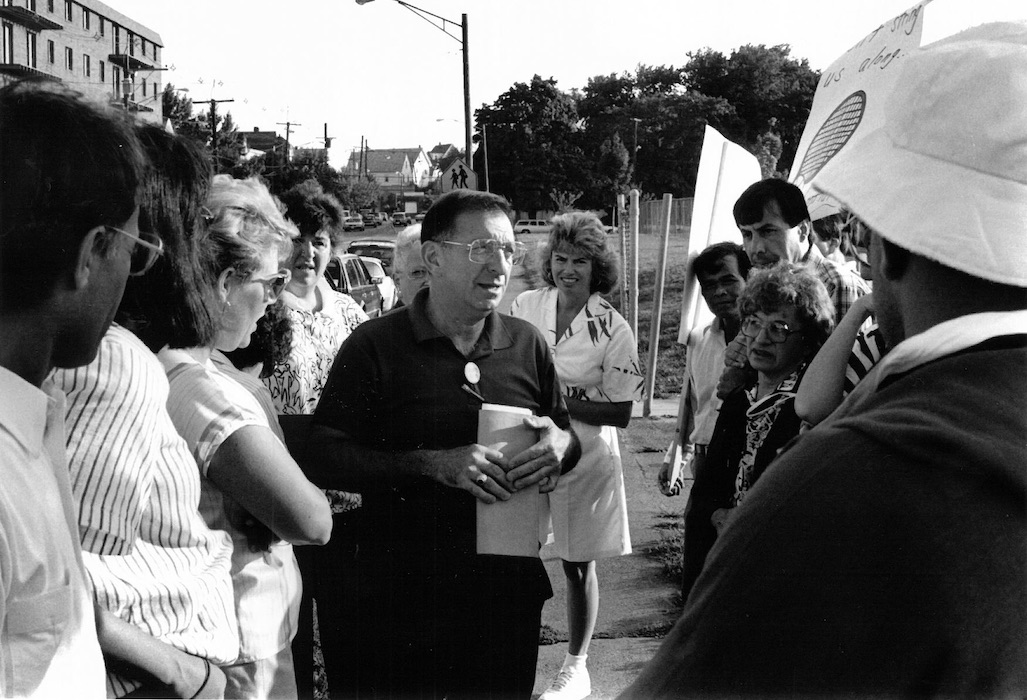 Man talking to a group of people.