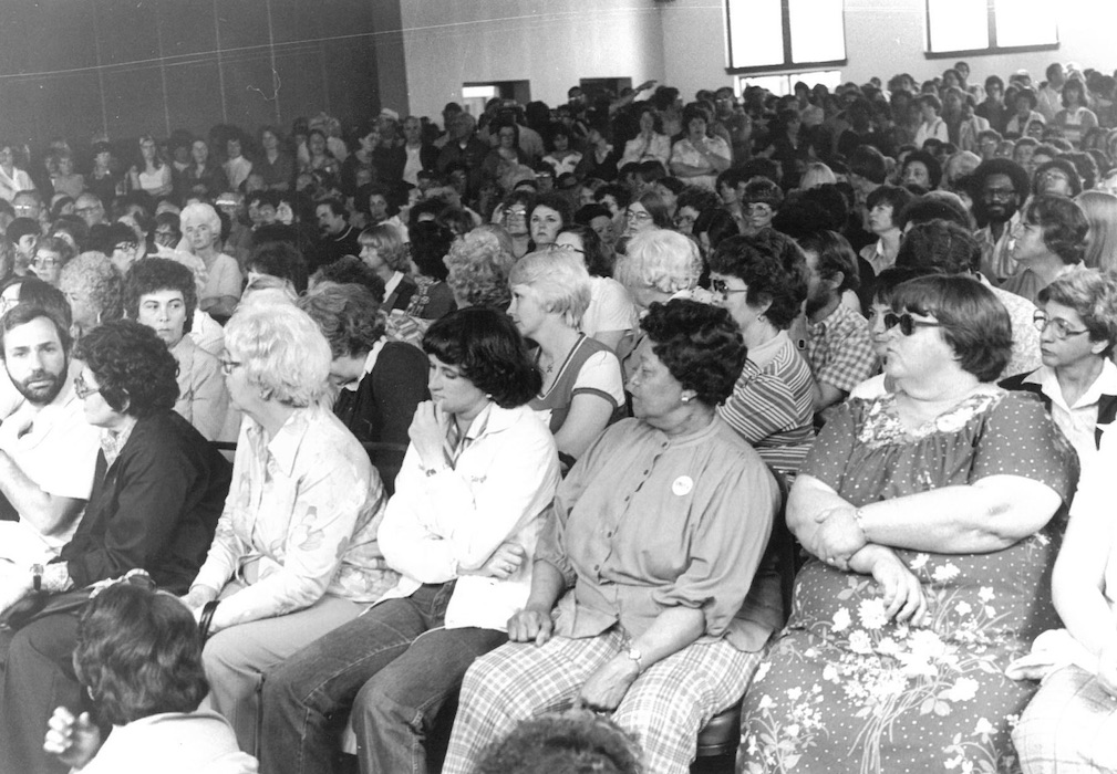 Crowd of seated people.