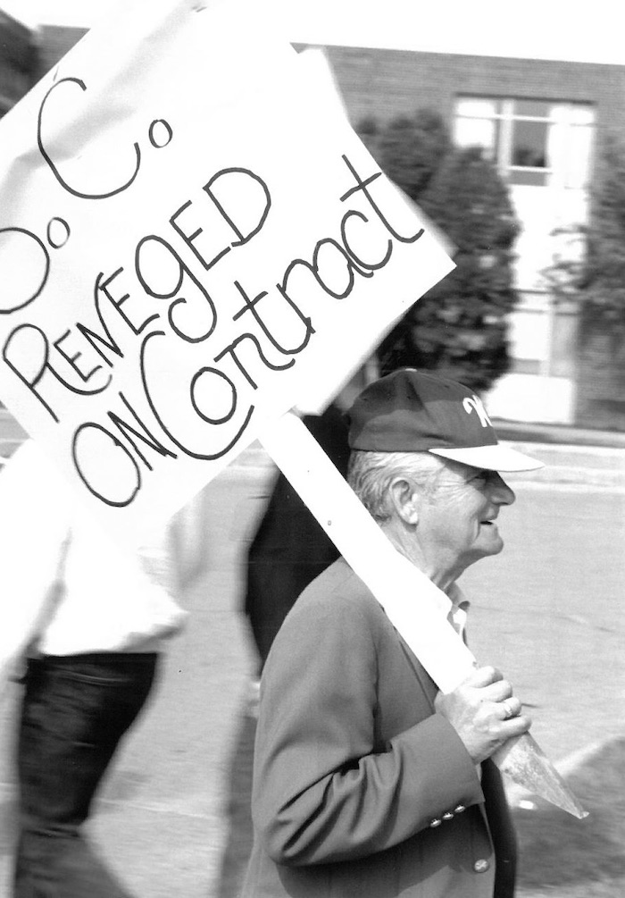 Picketer holding sign supporting the Wakefield strike.