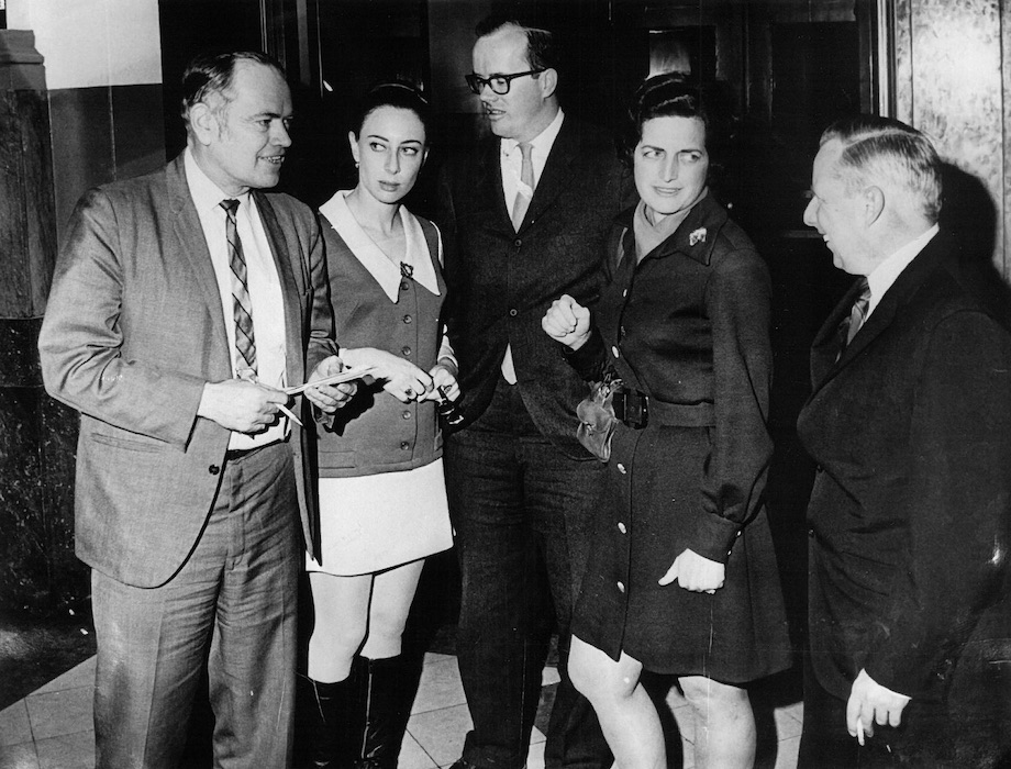 Group of people standing beside each other.