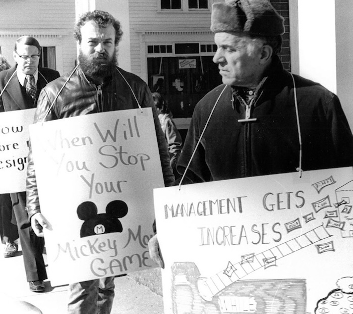 Picketers with signs supporting the Grafton strike.