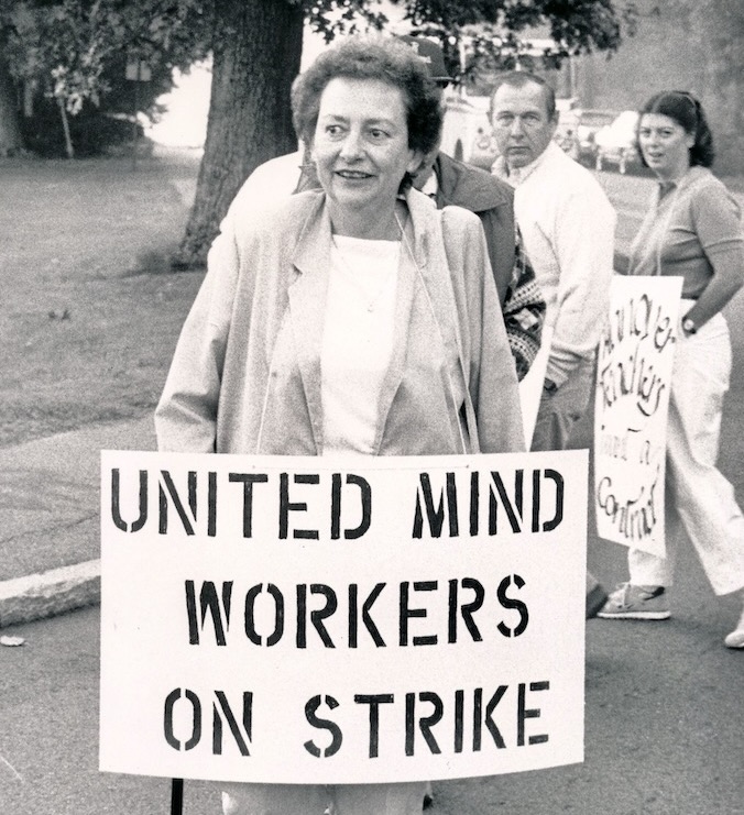Person in picket line holding sign supporting Hanover strike.
