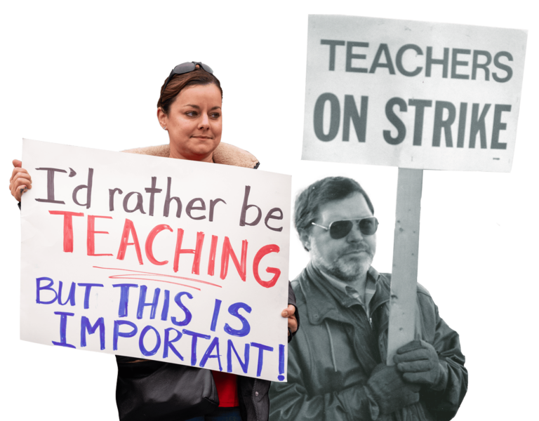 Two teachers hold picket signs.